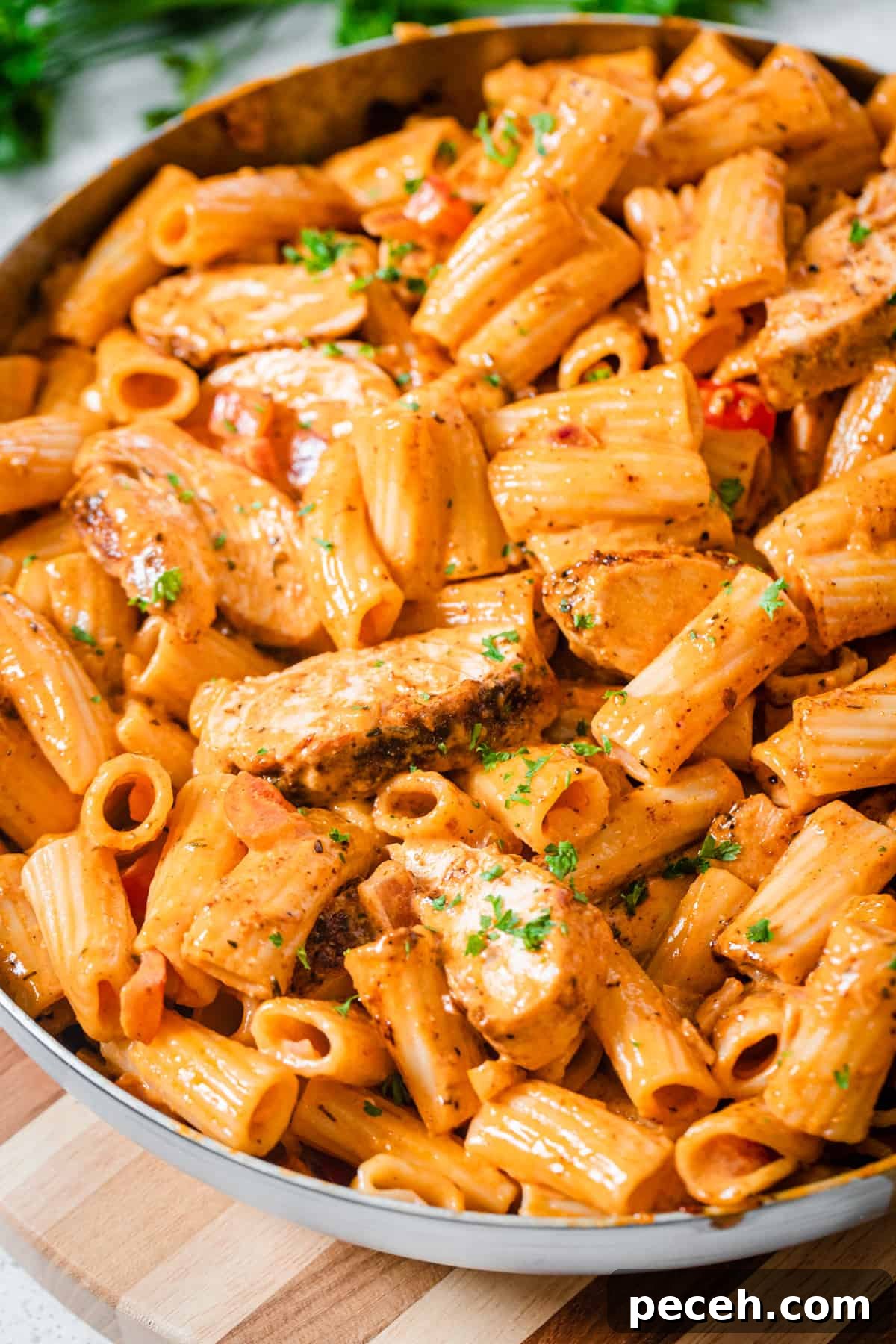 Creamy Cajun Chicken Pasta Recipe with Parmesan and Peppers 3 chicken and pasta in a pan