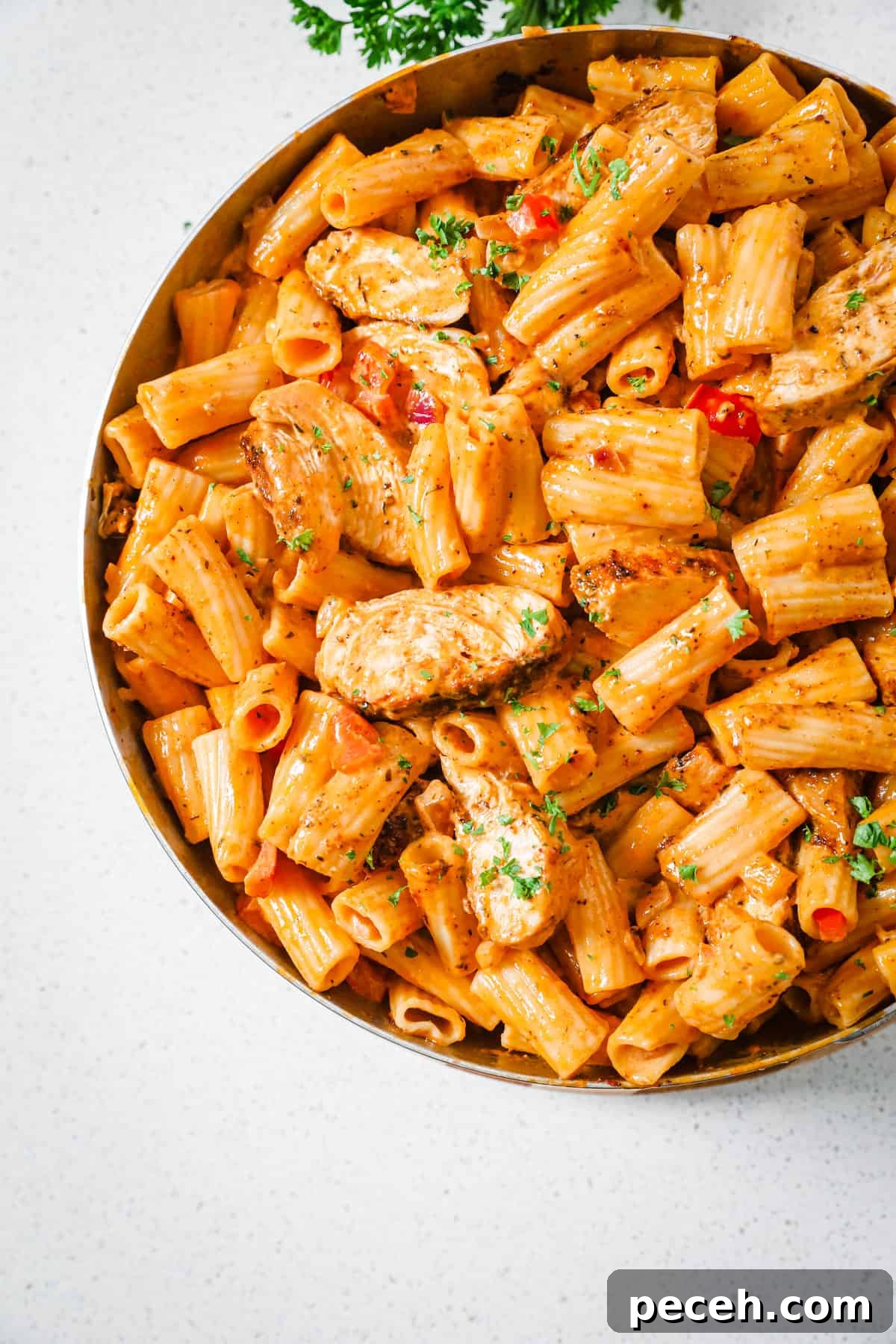 Creamy Cajun Chicken Pasta Recipe with Parmesan and Peppers 6 creamy pasta and chicken in a pan