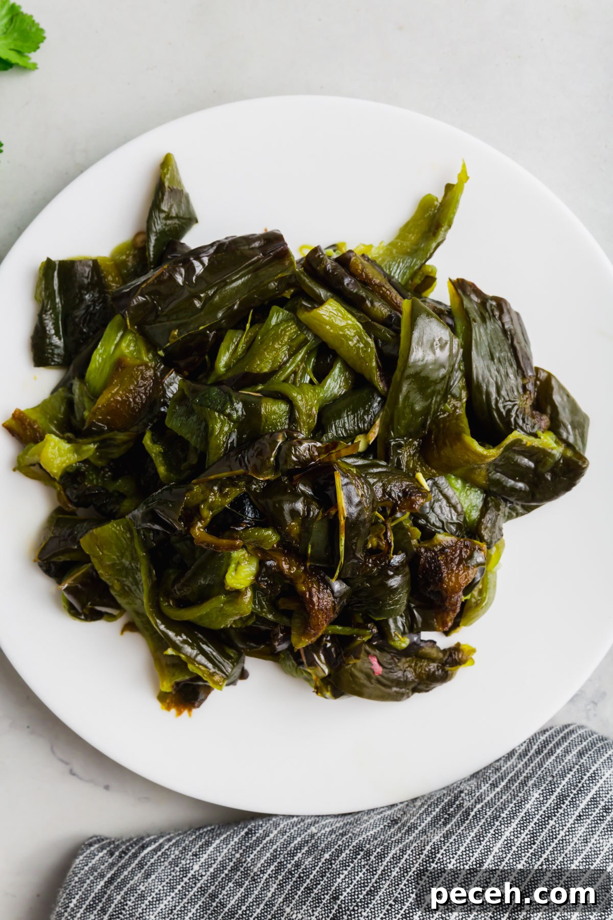 Roasted Chicken and Poblano Soup Recipe 5 A plate of roughly chopped roasted poblano peppers.