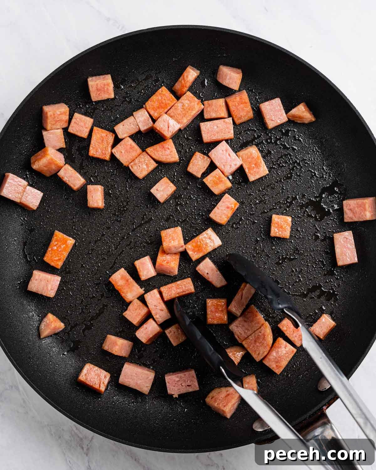 Crispy SPAM Fried Rice Recipe for Quick Weeknight Meals 4 Pan searing the spam.