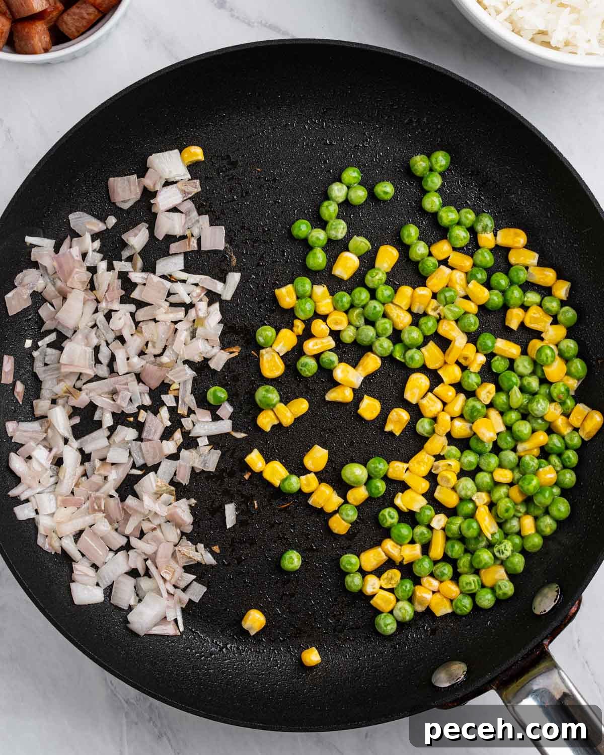 Crispy SPAM Fried Rice Recipe for Quick Weeknight Meals 6 Pan with shallots on left and corn and peas on the right.
