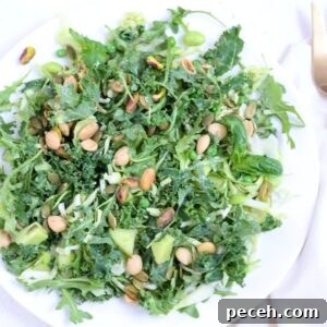 Creamy Green Goddess Salad with Homemade Herb Dressing 5 A salad on a white plate.