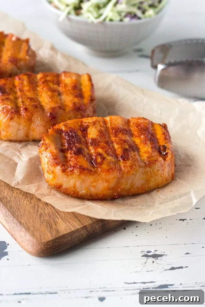 September 8, 2022 Grilling Picks: What’s on the Grill Today 2 smoked pork chops on parchemnt paper