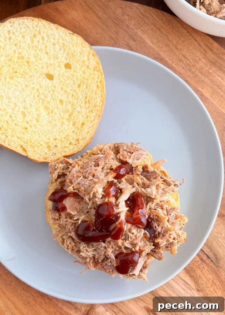 Tender Pulled Pork in the Instant Pot: Quick, Juicy Recipe 6 pulled pork on a bun with bbq sauce