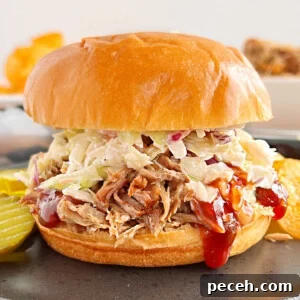 Tender Pulled Pork in the Instant Pot: Quick, Juicy Recipe 7 Instant Pot pulled pork sandwich with coleslaw and bbq sauce