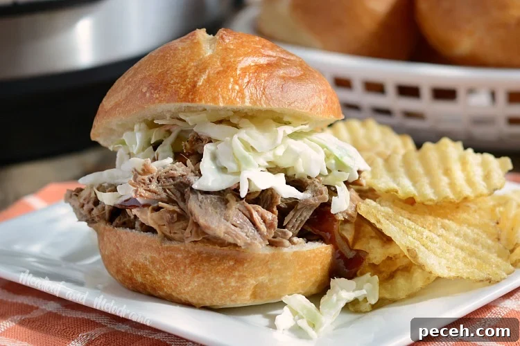 Tender Pulled Pork in the Instant Pot: Quick, Juicy Recipe 8 instant pot pulled pork sandwich with coleslaw and chips