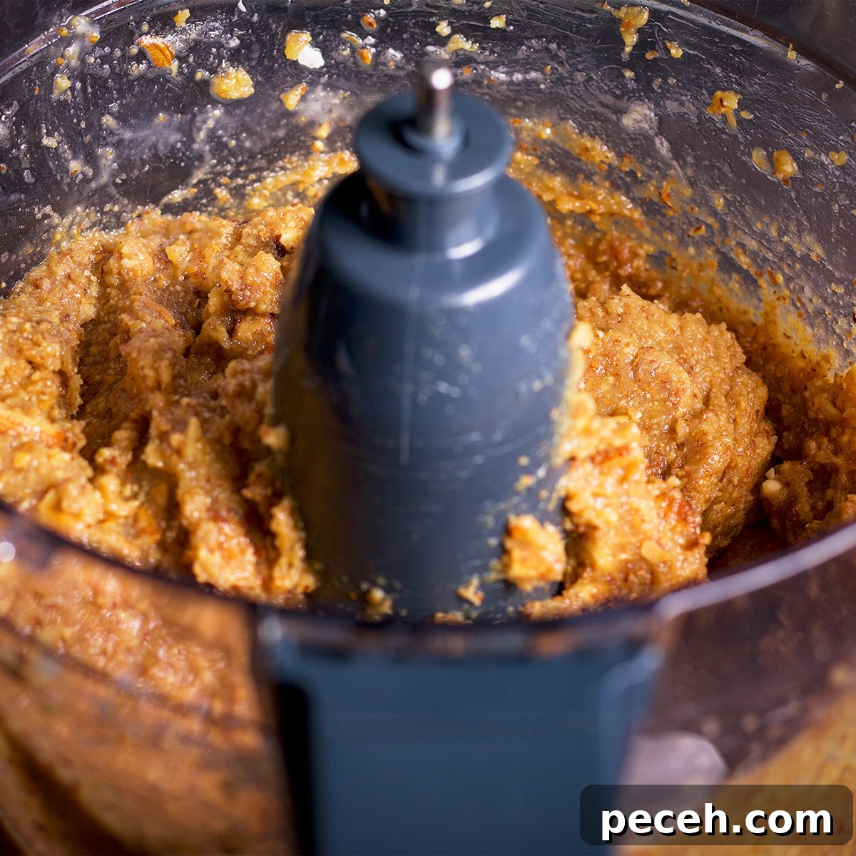A food processor that contains all the ingredients to make frangipane.
