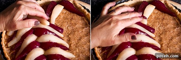 Arranging poached pears over the top of a pear tart.
