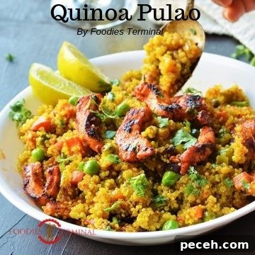 Quinoa Pulao served in a white bowl with lemon wedges