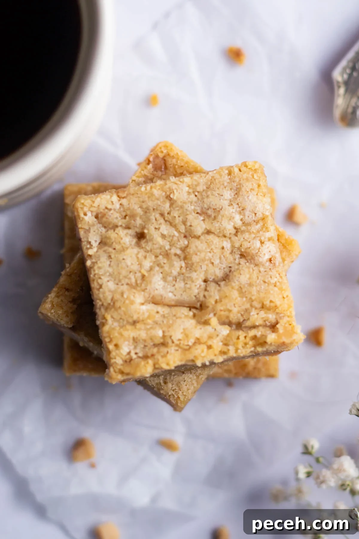 Chewy Browned-Butter Blondies with Crisp Edges 3 overhead look at the crinkly top on blondies with a cup of coffee