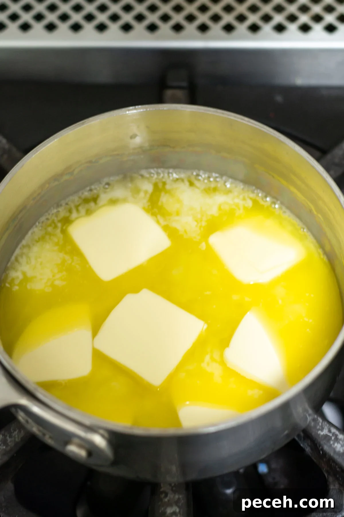 Chewy Browned-Butter Blondies with Crisp Edges 5 butter cubes melting in a saucepan