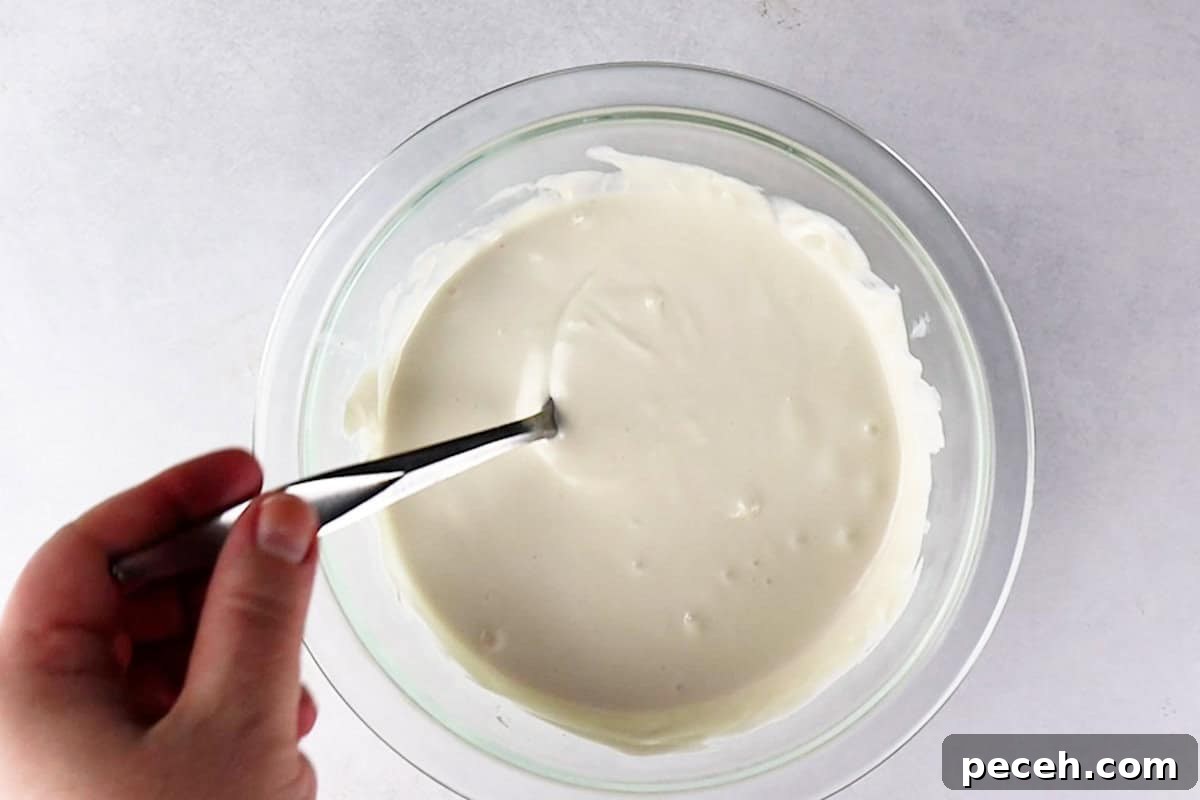 melted white candy melts in glass bowl.