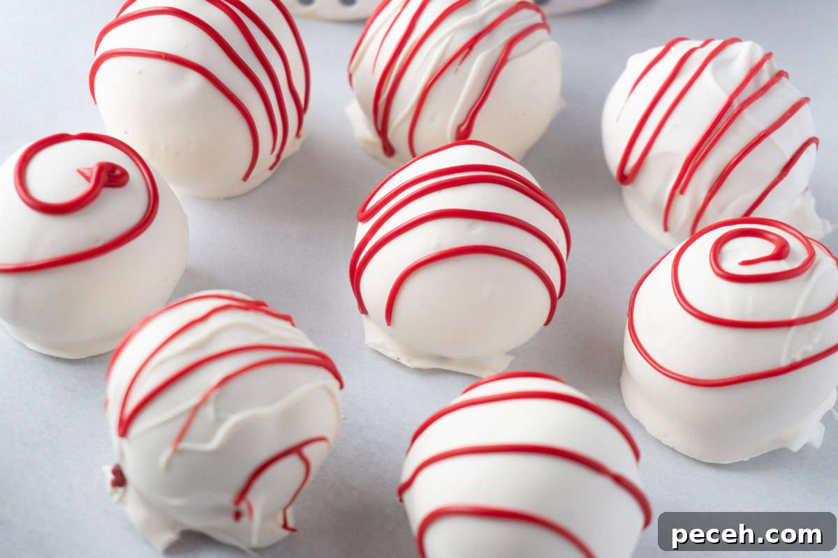 red velvet cake balls decorated with red stripes.