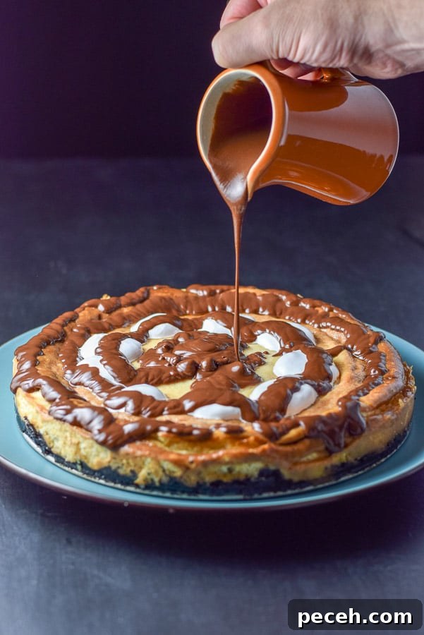 Decadent Rocky Road Cheesecake Recipe for Chocolate Lovers 8 More ganache being poured onto the cheesecake
