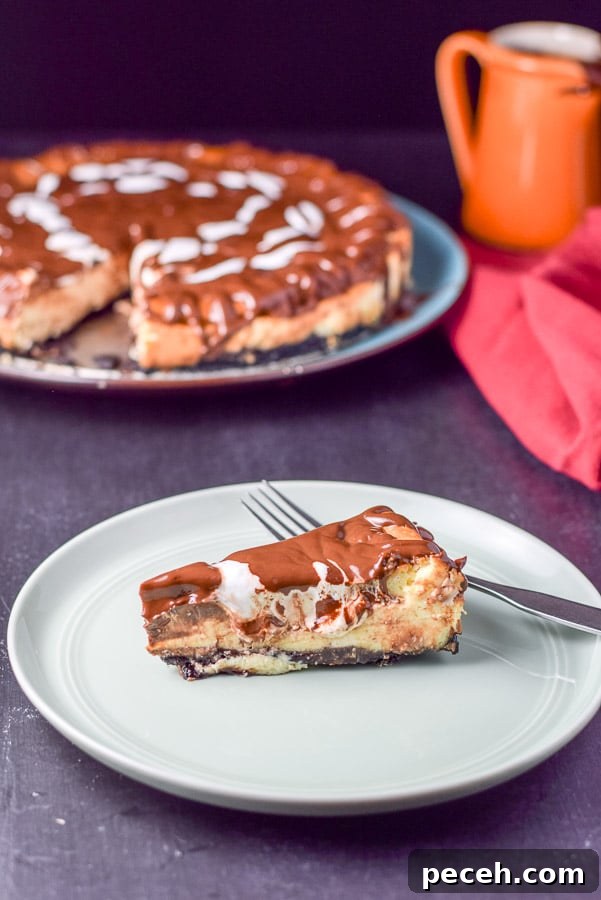 Decadent Rocky Road Cheesecake Recipe for Chocolate Lovers 10 Plated piece of cheesecake on a white plate with the cheesecake in the background