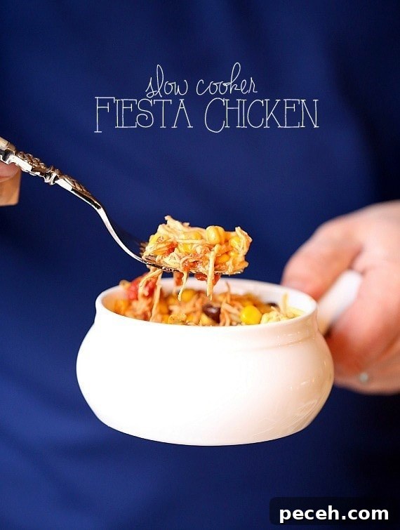 Slow Cooker Mexican Fiesta Chicken Recipe for Tender Shredded Meat 2 Slow Cooker Fiesta Chicken. Easy, low fat and can be used for so many dinners! | www.cookiesandcups.com