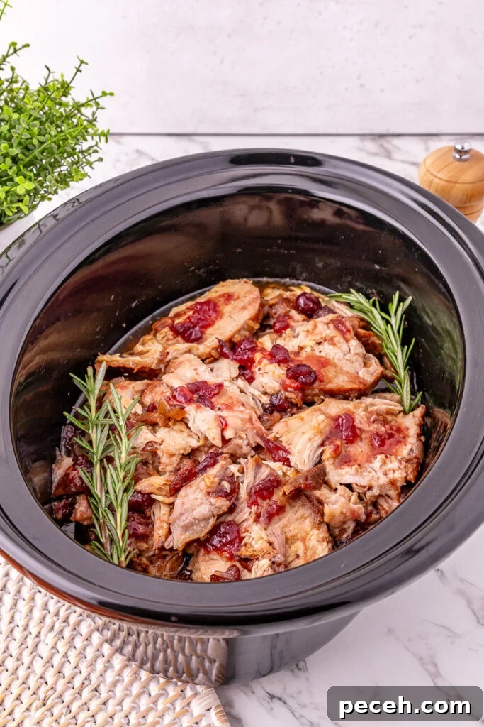 Shredded pork tenderloin in crockpot.
