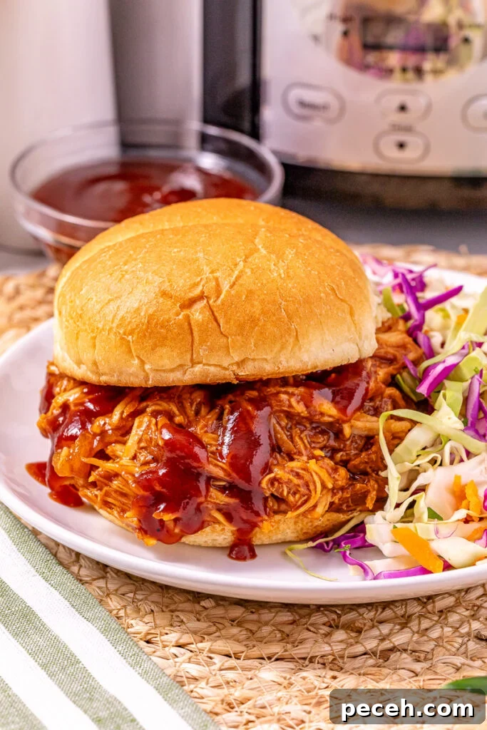 Crockpot bbq chciken served on a bun.