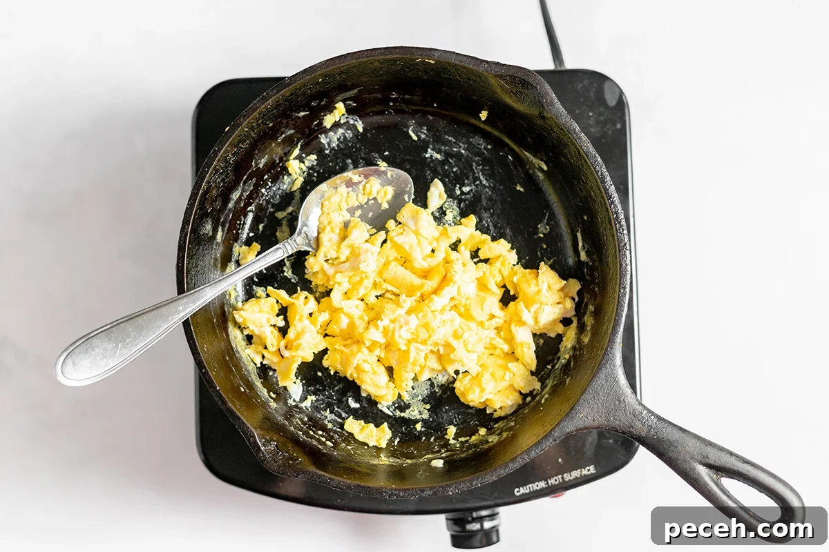 Ground Beef Fried Rice Recipe: Flavorful One-Pan Dinner 5 Scrambled eggs in cast iron skillet.