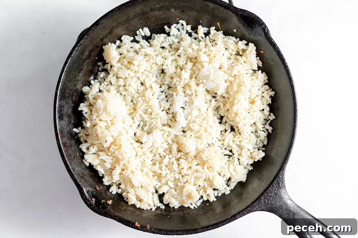 Ground Beef Fried Rice Recipe: Flavorful One-Pan Dinner 7 Rice in cast iron skillet.