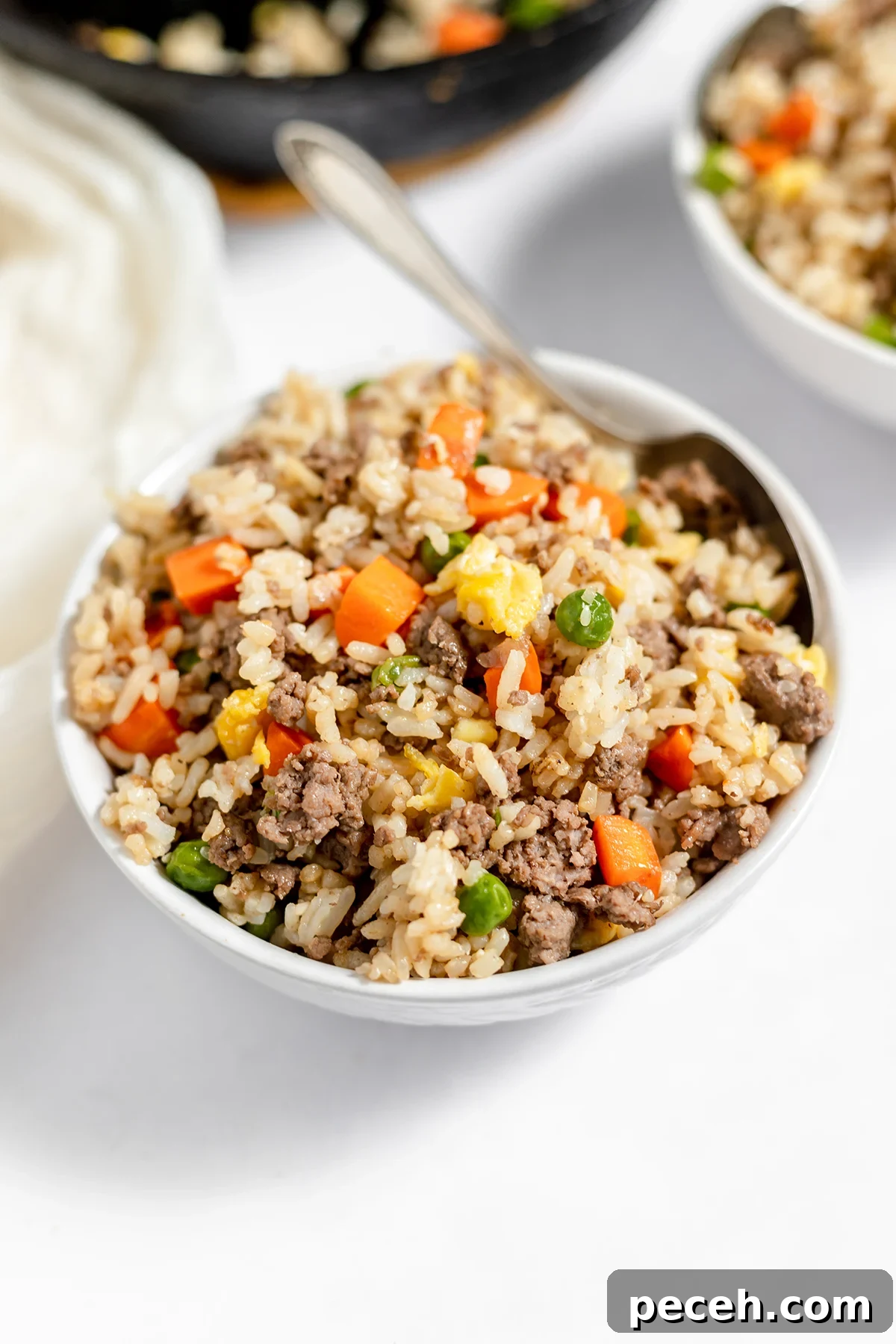 Ground Beef Fried Rice Recipe: Flavorful One-Pan Dinner 10 Beef Fried Rice in large white bowl.