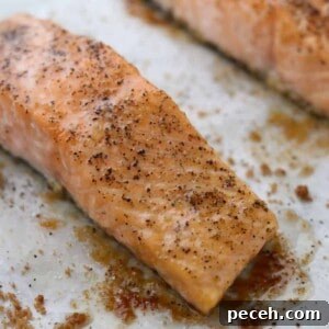 Close up of Baked Salmon with Butter and Brown Sugar on a baking sheet.