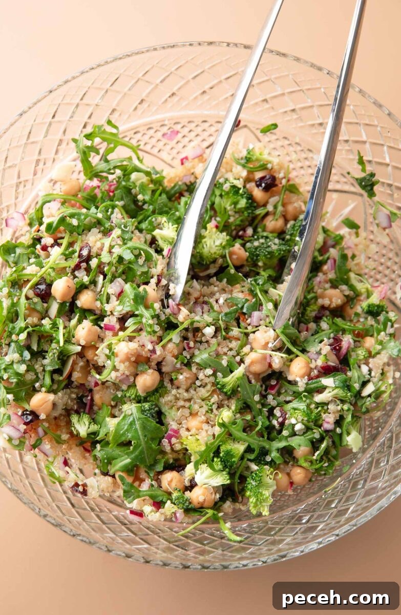 Lemony Quinoa and Arugula Salad with Cherry Tomatoes 6 Quinoa Arugula Salad tossed in a glass serving bowl