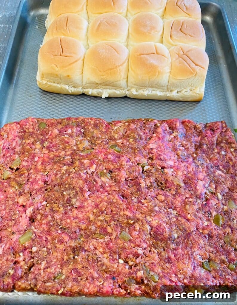 giant burger patty before cooking on the griddle