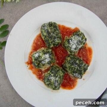 Keto Spinach and Ricotta Gnocchi Recipe for Low-Carb Meals 2 Stuffed spinach ricotta gnocchi on a white plate.