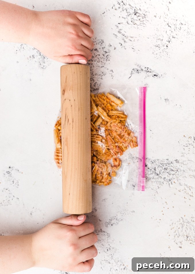 Crispy Crunch Toppings to Elevate Macaroni and Cheese 4 cheese crisps in a plastic bag being crushed with a rolling pin
