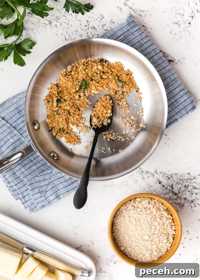 Crispy Crunch Toppings to Elevate Macaroni and Cheese 5 toasted panko breadcrumbs in a skillet, surrounded by butter and a bowl of un-toasted crumbs