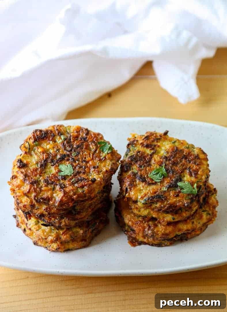 Gluten-Free Baked Zucchini Fritters Recipe 8 A plate of food on a table, with Fritters