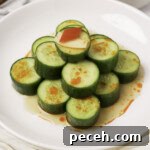 Din Tai Fung–Style Cucumber Salad Recipe 13 A stack of cucumbers on a plate just like Din Tai Fung.