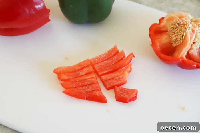 Slow Cooker Chicken Fajita Sliders Recipe for Game Day 3 diced bell peppers on a cutting board