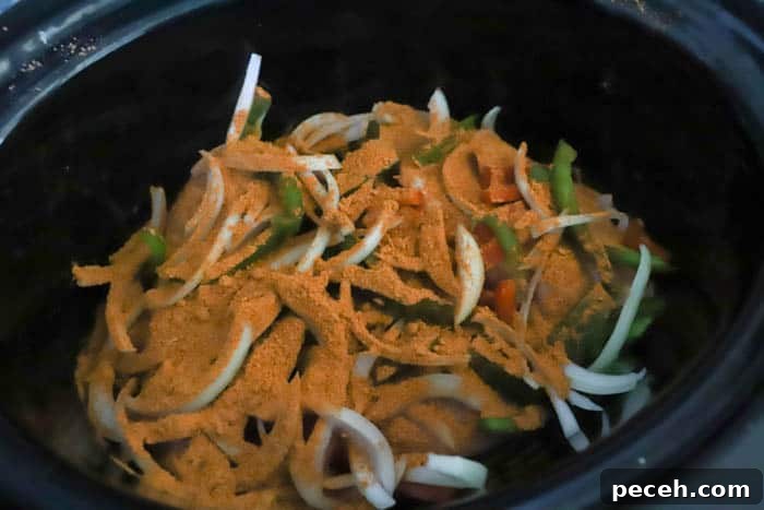 Slow Cooker Chicken Fajita Sliders Recipe for Game Day 4 adding all ingredients to a slow cooker