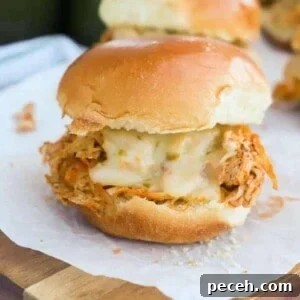 Slow Cooker Chicken Fajita Sliders on a cutting board