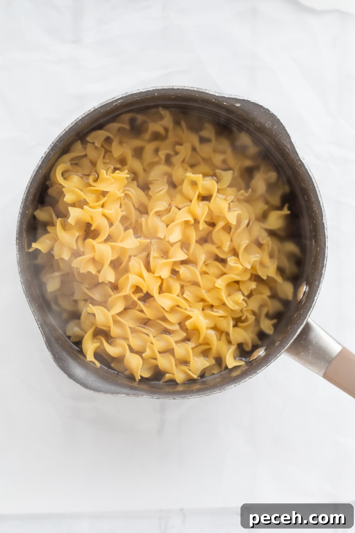 egg noodles boiling in a pot