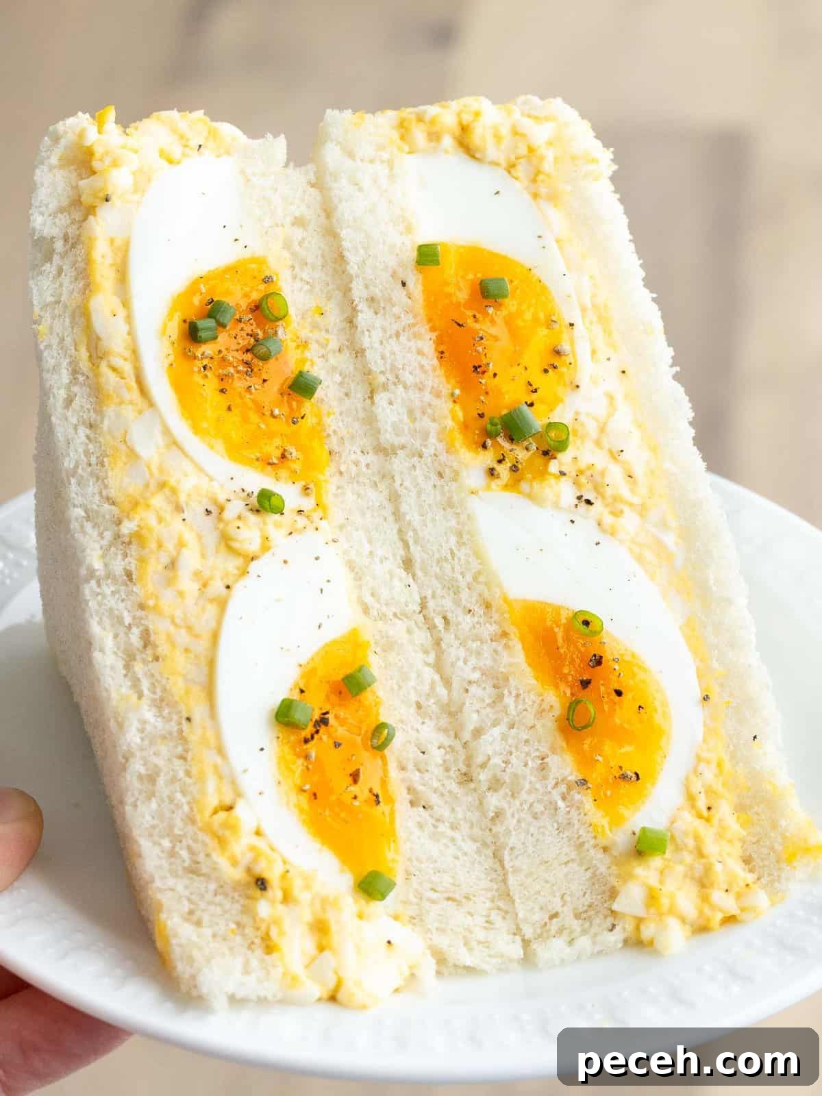 Fluffy Tamago Sando: Authentic Japanese Egg Sandwich Recipe 2 Japanese egg sandwich or tamago sando on a plate.