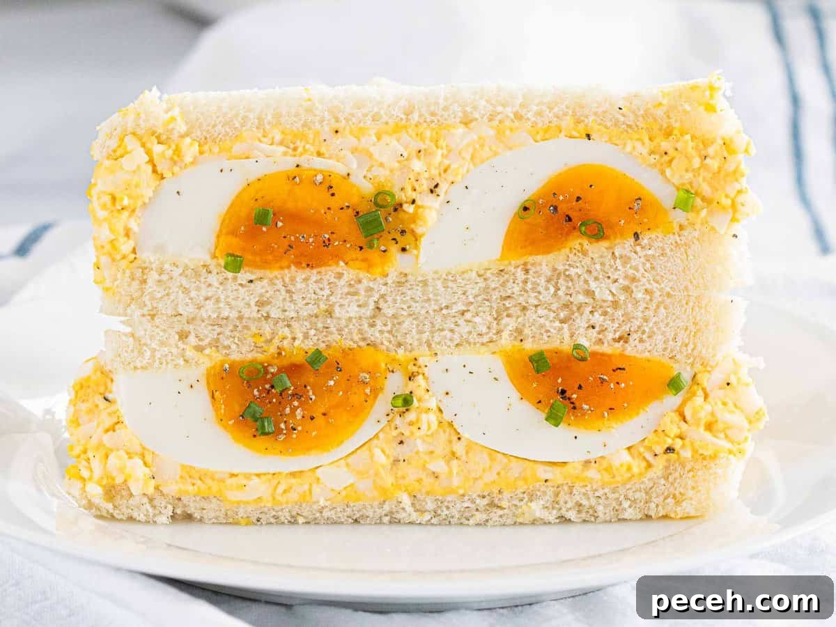 Fluffy Tamago Sando: Authentic Japanese Egg Sandwich Recipe 9 Tamago sando on a plate.
