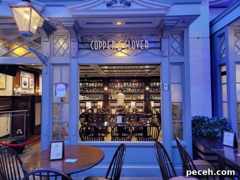 3-Night Royal Caribbean Navigator of the Seas Cruise to Ensenada 7 Copper & Clover sign over a window looking into a bartender, tables and chairs