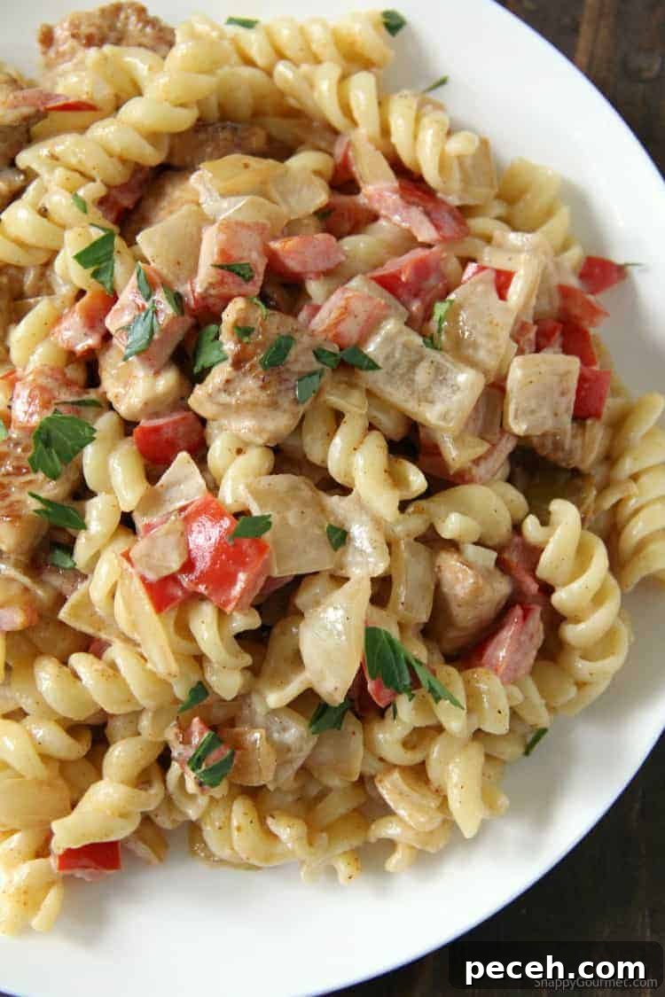 Cajun Chicken Alfredo - easy dinner recipe with from scratch Cajun alfredo sauce Cajun Chicken Alfredo pasta on plate