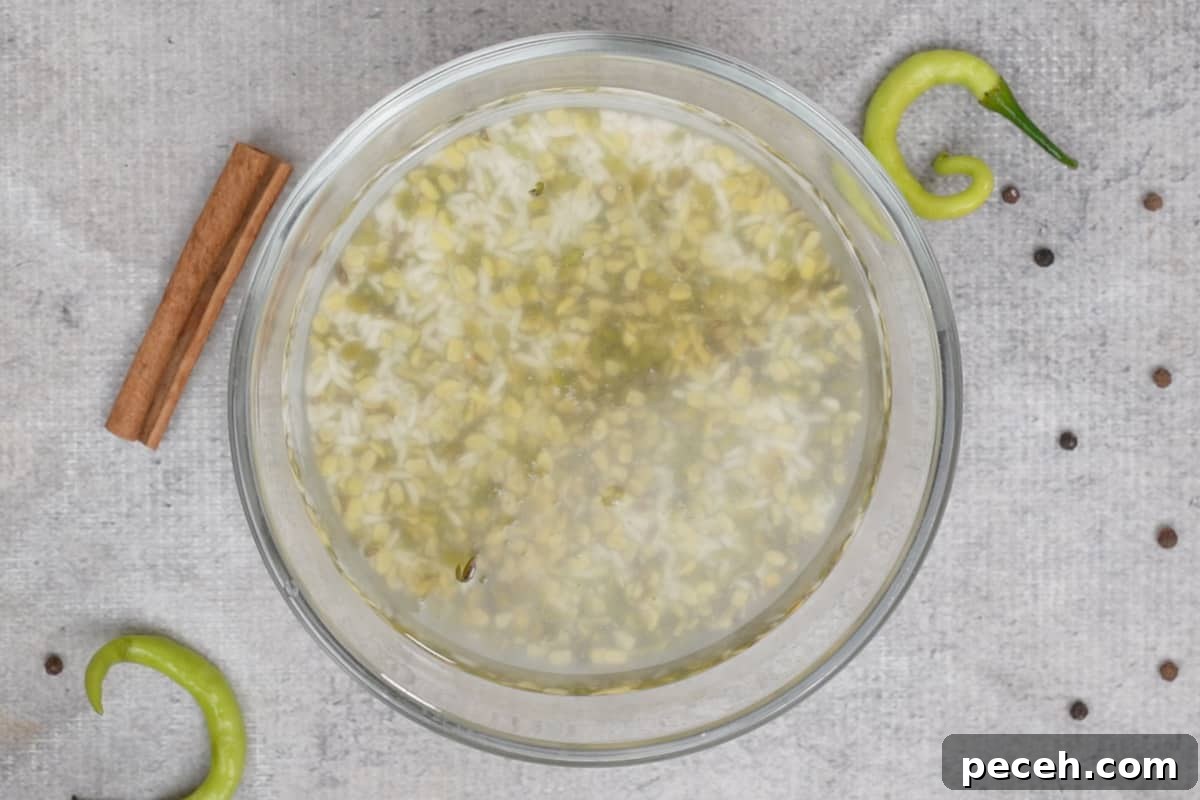 Spiced Khichdi Recipe: Comforting One-Pot Indian Meal 3 Soaked rice and lentils in a bowl.