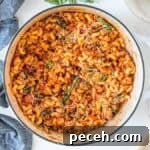 Ground chicken parmesan pasta in large white pot.