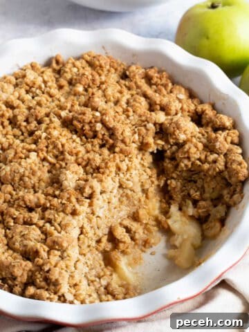 Easy cinnamon apple crumble in a pie dish.