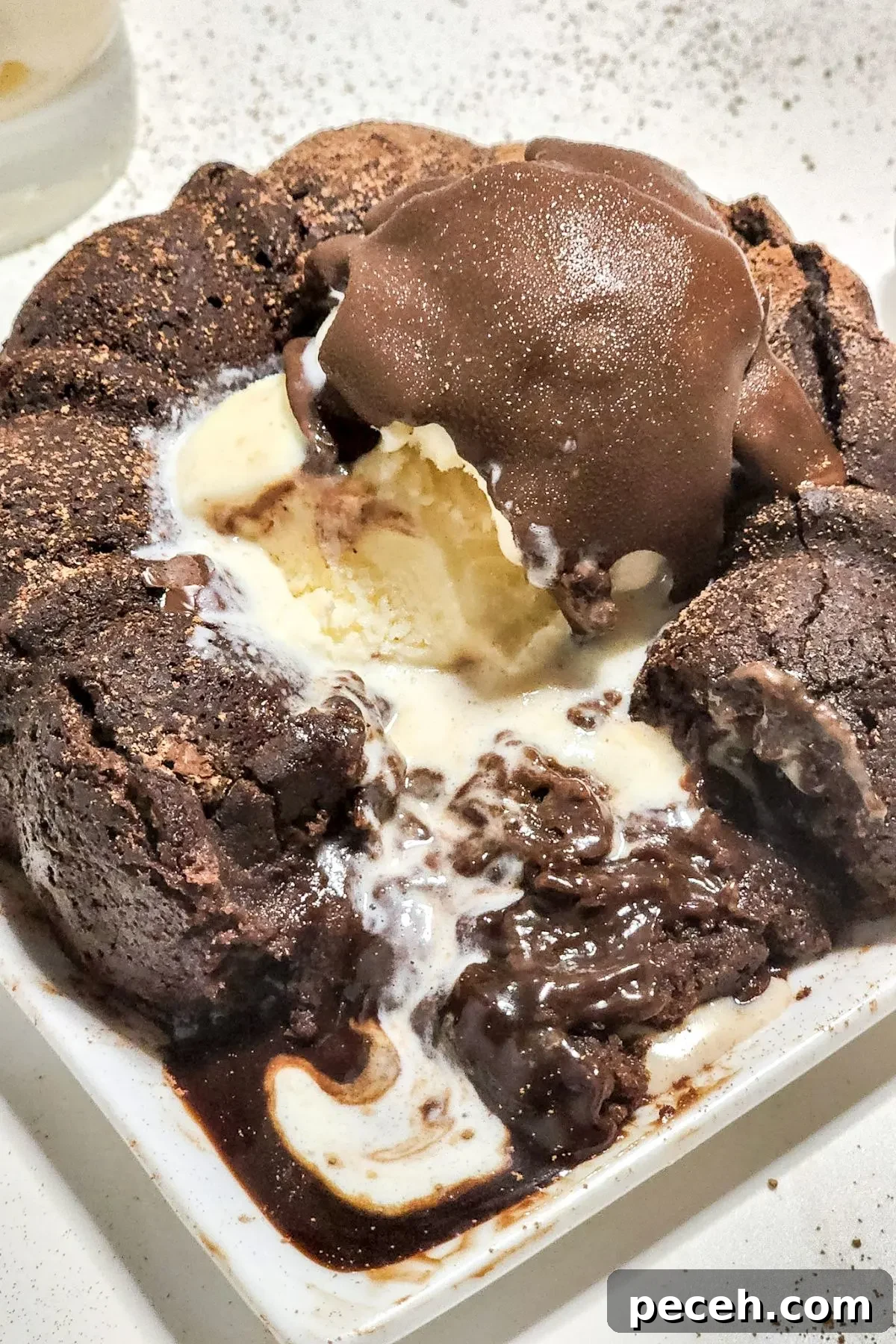 An oozing chocolate molten lava cake on a plate. 