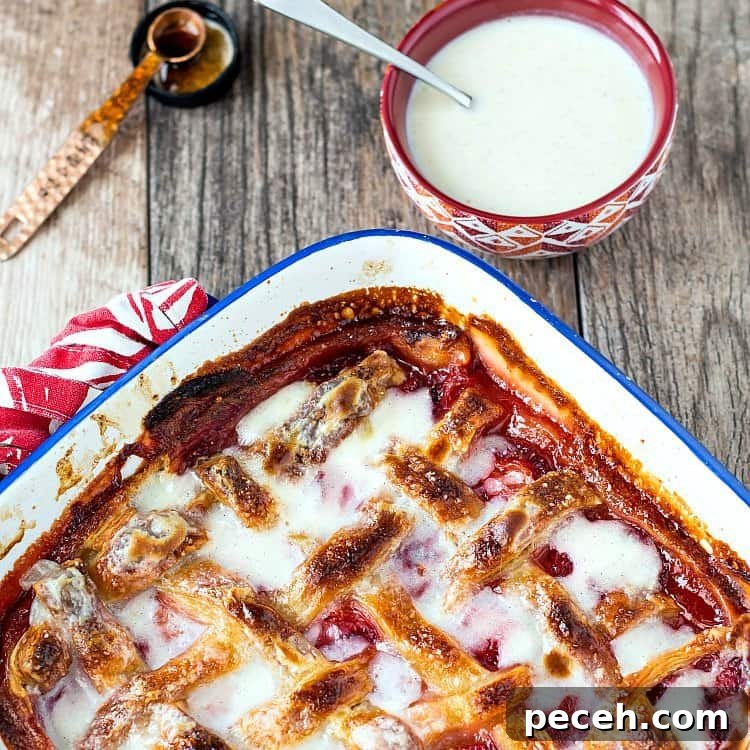 A casserole with fruit cobbler with lattice crust.