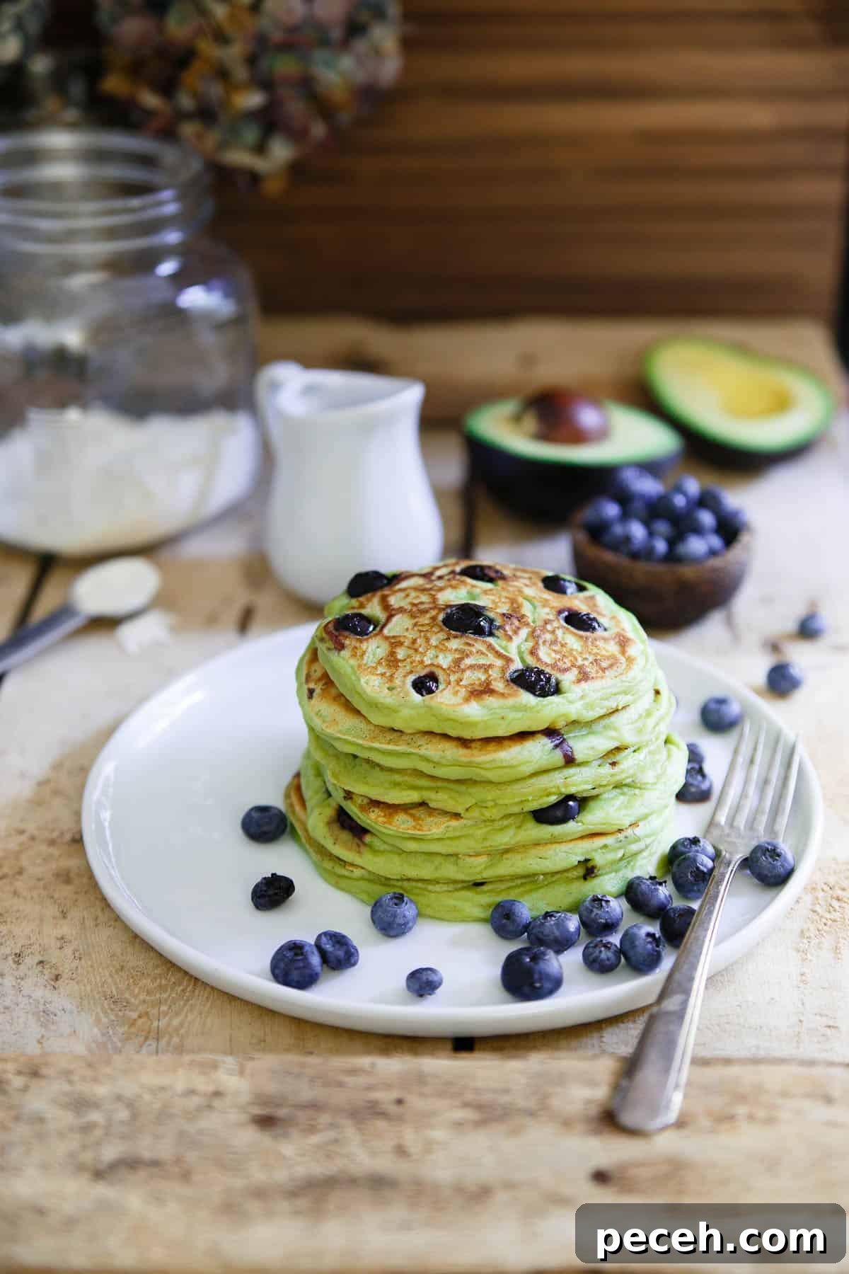 These avocado pancakes are packed with fresh blueberries, fluffy, thick and when topped with a poached egg, the perfect combination of savory and sweet.