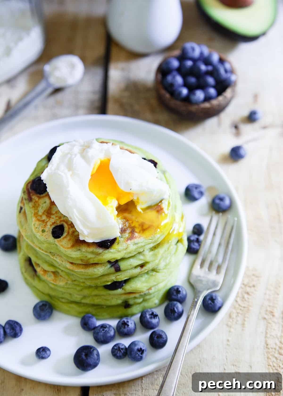 Blueberry Avocado Pancakes are thick, decadent and perfect with a poached egg on top.