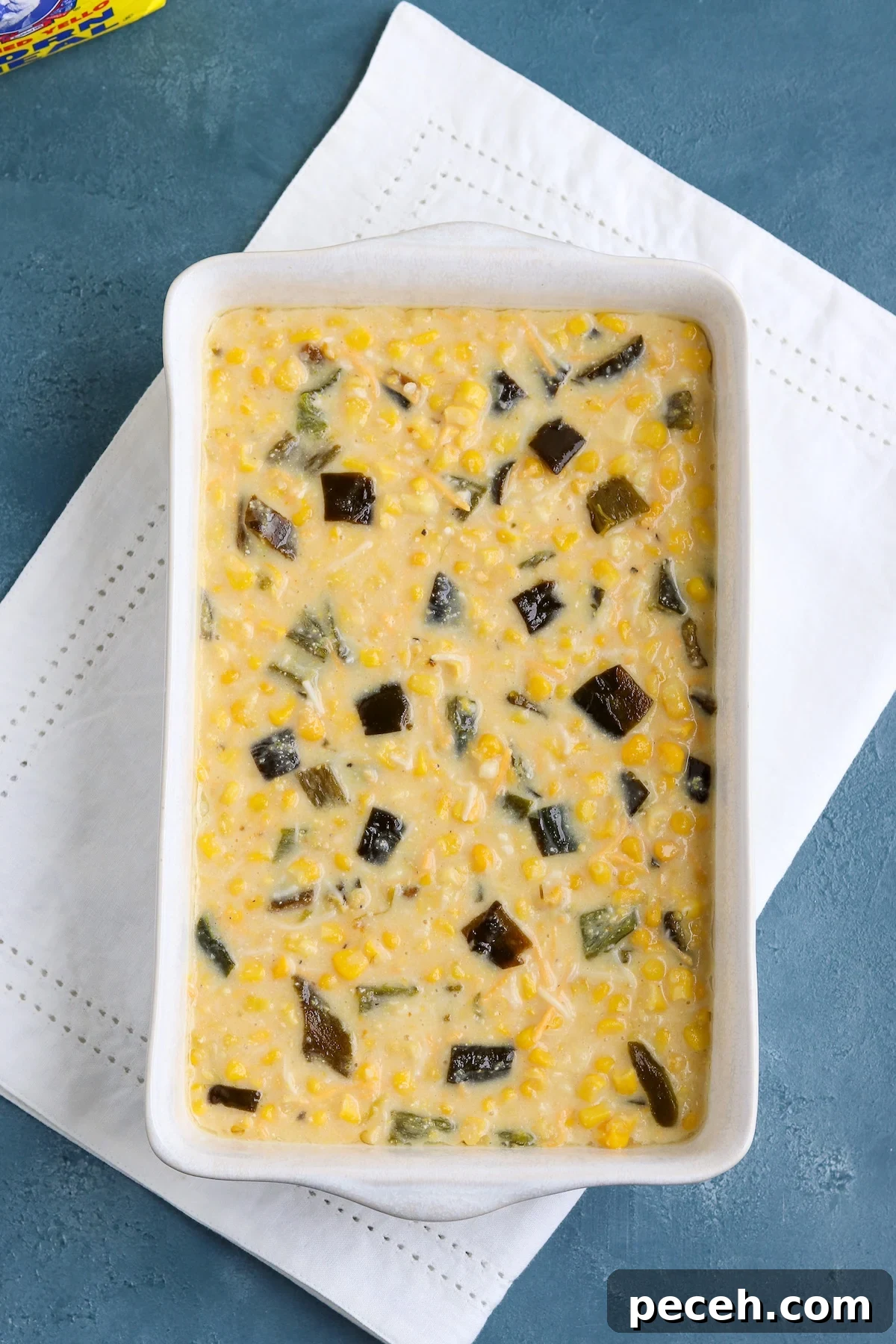 unbaked casserole dish of corn casserole
