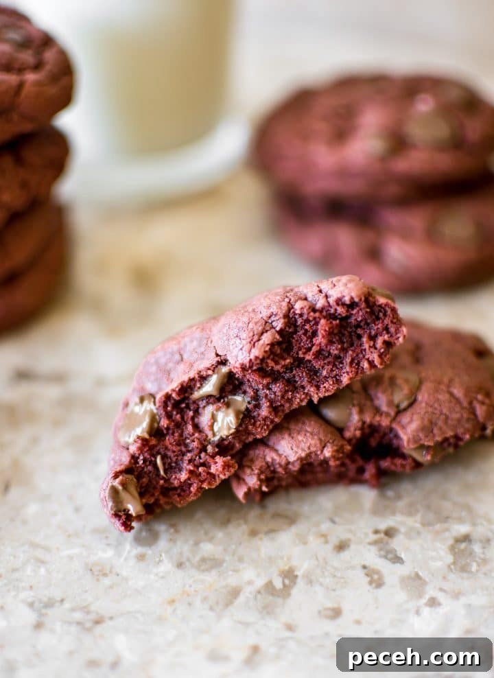 Red Velvet Cake Mix Cookies Recipe — Soft, Chewy Treats 3 easy red velvet cake cookie broken in half close-up
